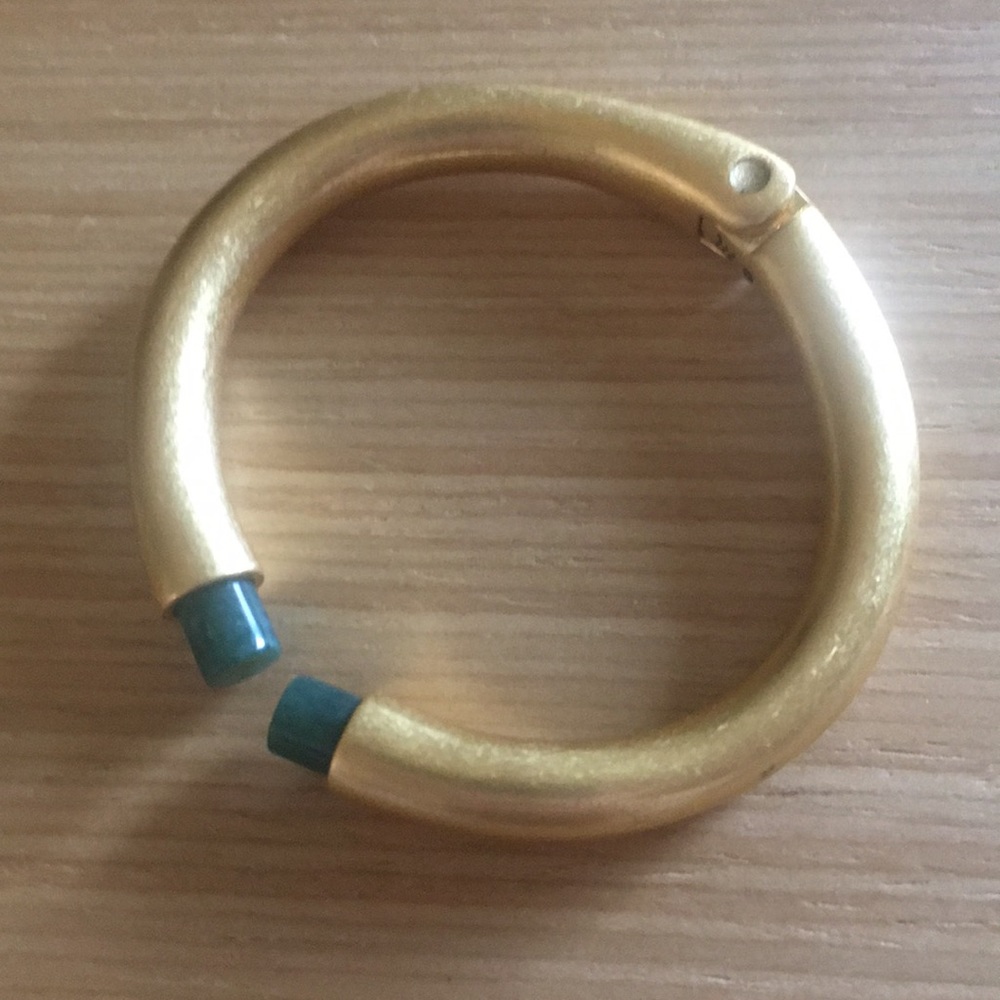 Gold hinge bracelet with green stones